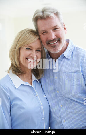 Portrait Of Loving Mature Couple At Home Stock Photo