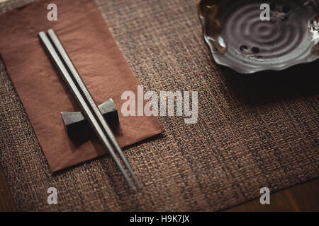 Close-up of chopstick on dining table Stock Photo