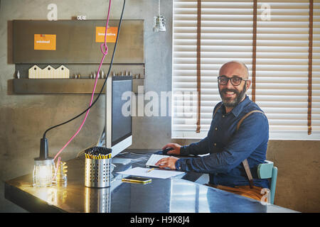 Businessman working on laptop for new architectural project. Stock Photo