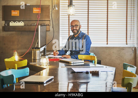 Businessman working on laptop for new architectural project. Stock Photo