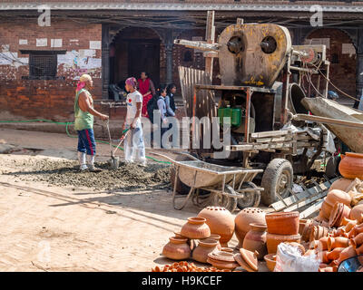 Two workmen taking a break from repairing the street in Nepal Stock Photo