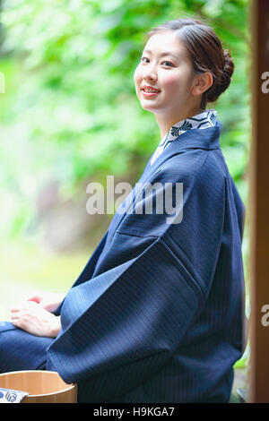 Young Japanese woman wearing yukata at traditional onsen hot spring