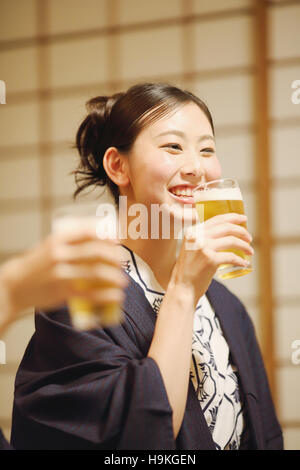 Young Japanese woman wearing yukata at traditional ryokan inn