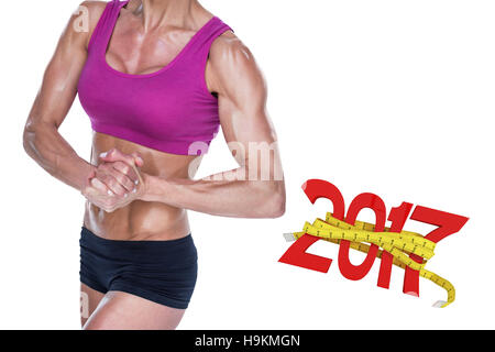 3D Composite image of female bodybuilder posing with hands together Stock Photo