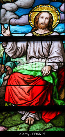 Stained glass window depicting the Sermon on the Mount by Christ, in Saint James's Church in Stockholm, Sweden. Stock Photo