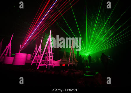 Lasers create shapes inside the Biomes at the Eden Project in Cornwall where a new show, curated by light artist Chris Levine who led Glastonburys laser tribute to David Bowie, opens on Friday 25 November as part of the Eden Festival of Light and Sound. Stock Photo