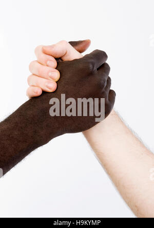 Black and white shaking hands in friendship Stock Photo