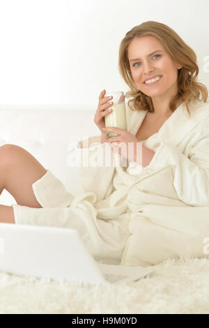 Young woman drinking milk Stock Photo