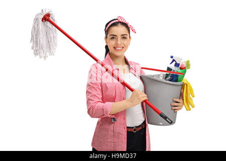 Happy young woman holding a mop and a bucket filled with cleaning products isolated on white background Stock Photo