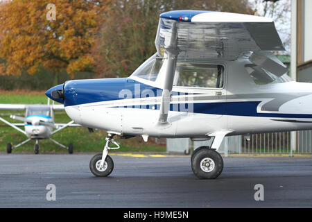 Two Cessna 152 aircraft part of a flying club flight school fleet of basic training aircraft at an airfield in the UK Stock Photo