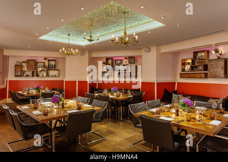 Dining table and chairs in conference room at the Zetter hotel, Clerkenwell, London, UK Stock Photo