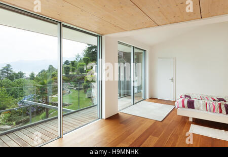 Interior, modern house, bedroom with balcony Stock Photo