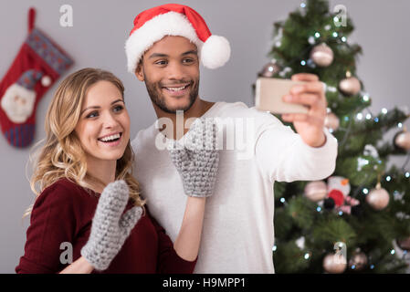 Happy nice couple taking selfies Stock Photo