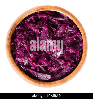Cooked red cabbage in wooden bowl. Brassica oleracea, also purple cabbage, red or blue kraut. Stock Photo