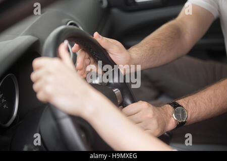 Man trying to take control of the steering wheel Stock Photo
