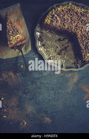 Served homemade chocolate cake on dark background with blank space Stock Photo
