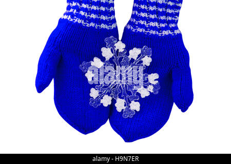 Christmas concept blue mittens with toy snowflake on a white background Stock Photo