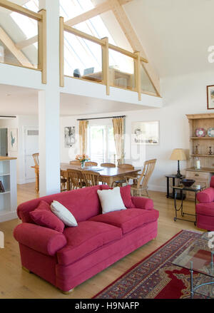 red sofa in double height living room. Stock Photo