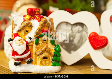 Heart shaped photo frame on wood table Against the background of Christmas toys Stock Photo