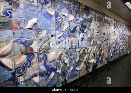 Wall made from tiles with relief and multicolored abstract pattern Stock Photo