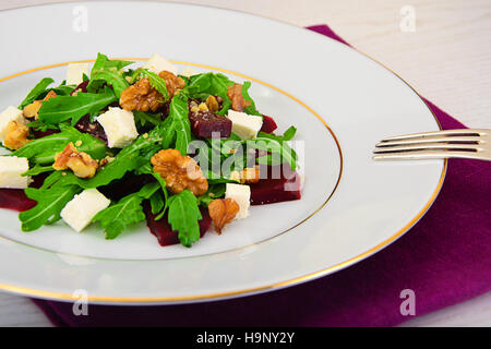 Arugula Salad, Boiled Beets, Cheese and Walnuts Stock Photo