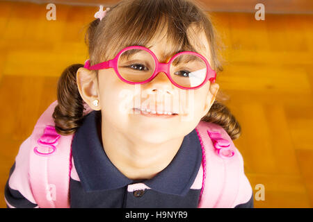 Smart School Girl Wearing Uniform and looking up Stock Photo
