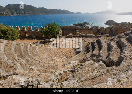 Antique theatre in the ruins of the ancient city of Simena along the Mediterranean coast of Turkey. Stock Photo