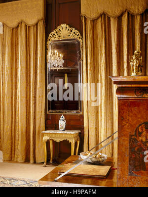 Partial room view of the Saloon at Antony House showing the Queen Anne pier-glass, made for the room with bevelled Vauxhall plate glass, Stock Photo