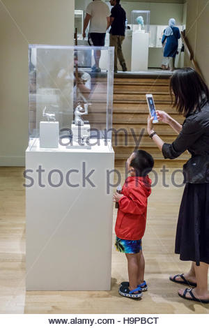New York City,NY NYC,Manhattan,Upper East Side,Fifth Avenue,Metropolitan Museum of Art,Met,glass case,figurine,Asian Asians ethnic immigrant immigrant Stock Photo