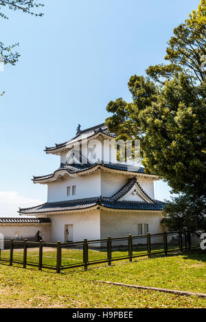 Japan, Akashi castle, AKA Kishun-jo. The three story Hitsujisaru yagura, turret, with blue sky background. Stock Photo