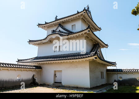 Japan, Akashi castle, AKA Kishun-jo. The three story Hitsujisaru yagura, turret, with blue sky background. Stock Photo
