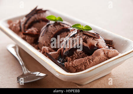 Chocolate ice cream with syrup close up Stock Photo