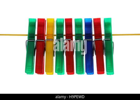 isolated colored plastic clothespins hanging on the rope Stock Photo