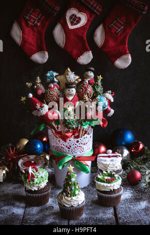 Christmas decoration on the table with cup cakes and cake pops,selective focus Stock Photo