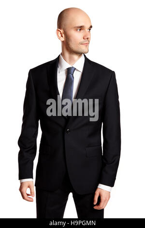 Elegant man looking at left. Studio shot of young man against white background. Stock Photo