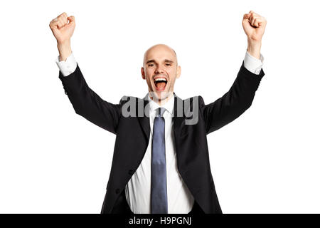 Portrait of a young man who raises his hands in a gesture of victory. Isolated on white background. Stock Photo
