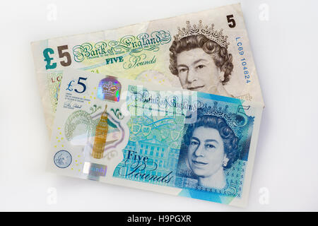New 2016 British five pound note and old paper note together Stock Photo