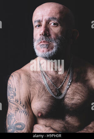 Portrait of senior bald man in low key Stock Photo