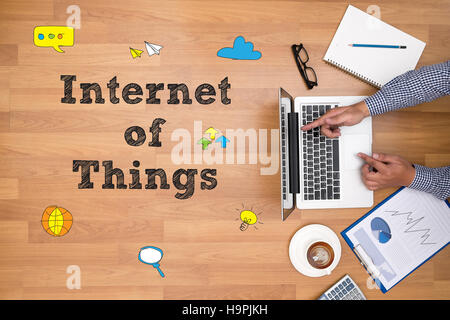 business man hand working and internet of things (IoT) word diag Stock Photo