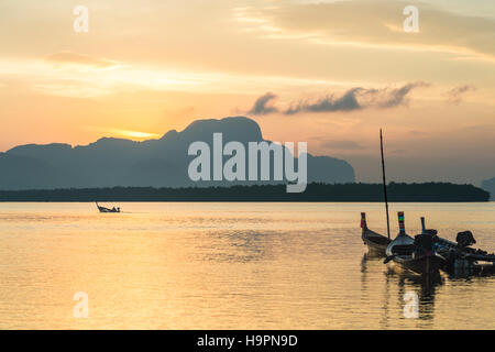 Longtail fishing boat at Samchong-Tai fishing village on sunrise in Phang-Nga, Thailand. Stock Photo