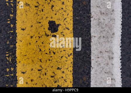 Asphalt highway Seamless texture with cracked white and yellow stripe Stock Photo