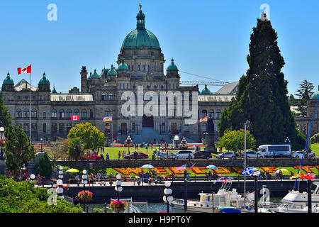 The legislative building in Victoria with welcome flowers and harbor front Stock Photo