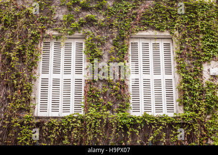 A typical pair of French windows and shutters in Tours, France. Stock Photo