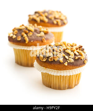 Sweet hazelnut muffins isolated on white background. Stock Photo