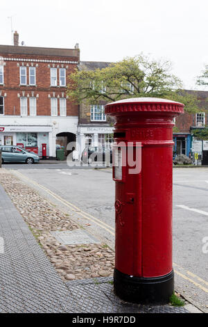 Winslow, Buckinghamshire, United Kingdom, October 25, 2016: Royal Mail red post box on Market Square, Winslow. Stock Photo