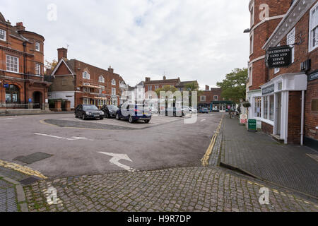 Winslow, Buckinghamshire, United Kingdom, October 25, 2016: Market Square with parked cars on grey chilly morning. Stock Photo