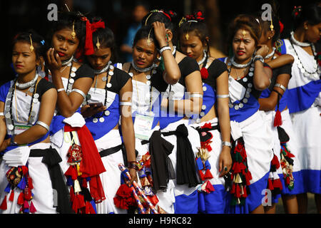 Kathmandu, Nepal. 25th Nov, 2016. Women from the Tharu community dressed in customary attire getting ready to perform a stick dance during a fish eating festival at Brikutimandap, Kathmandu, Nepal on Friday, November 25, 2016. © Skanda Gautam/ZUMA Wire/Alamy Live News Stock Photo