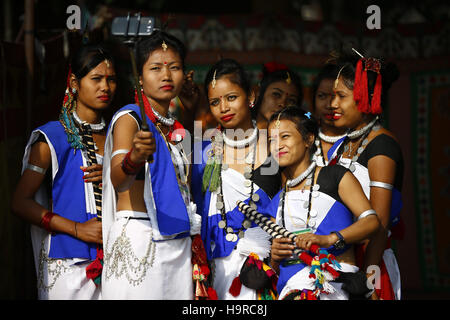 Kathmandu, Nepal. 25th Nov, 2016. Women from the Tharu community dressed in customary attire pose for a selfie from their smartphone before their stick dance during a fish eating festival at Brikutimandap, Kathmandu, Nepal on Friday, November 25, 2016. © Skanda Gautam/ZUMA Wire/Alamy Live News Stock Photo