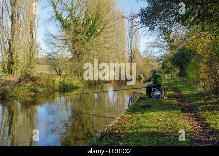 North Nottinghamshire, UK. 25th November 2016.  Freshwater fisherman and his cocker spaniel on the banks of Chesterfield canal. Credit:  Ian Francis/Alamy Live News Stock Photo