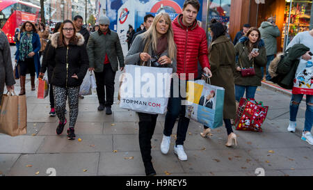 London, UK.  25 November 2016.  Shoppers are seen in Oxford Street on 'Black Friday', the imported US retail phenomenon, where retailers heavily discount goods.  This year, analysts predict most sales will be online, but bricks and mortar retailers continue to attract customers. Credit:  Stephen Chung / Alamy Live News Stock Photo